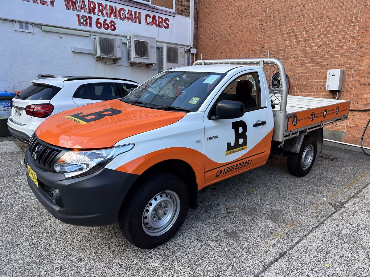 Clear photograph of the genuine smaller JB flatbed truck