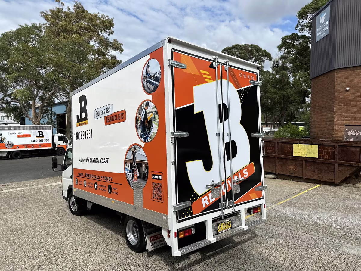 Rear three-quarter view of a real JB Removals pantech truck