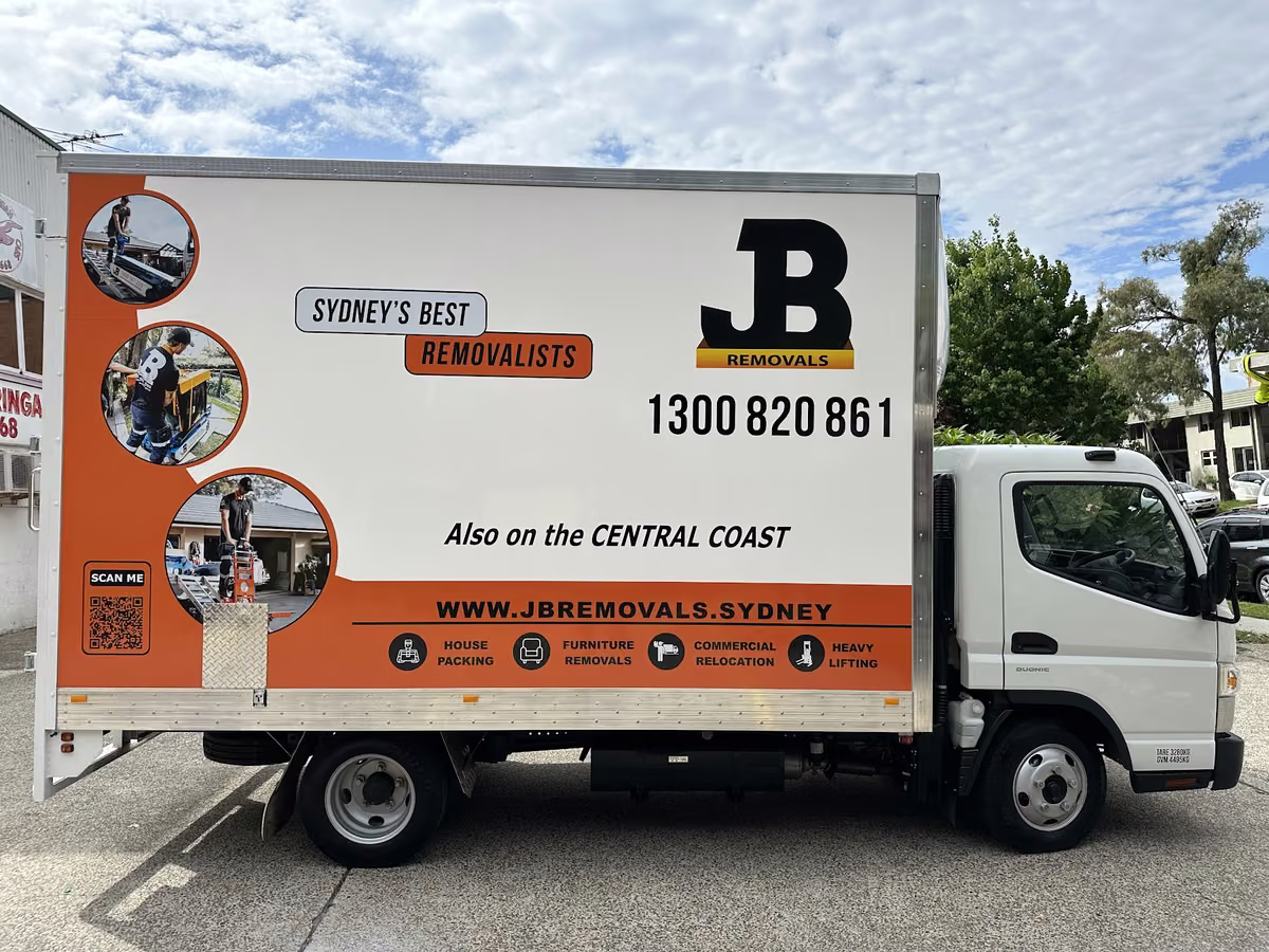 Side view of a real JB Removals branded pantech truck