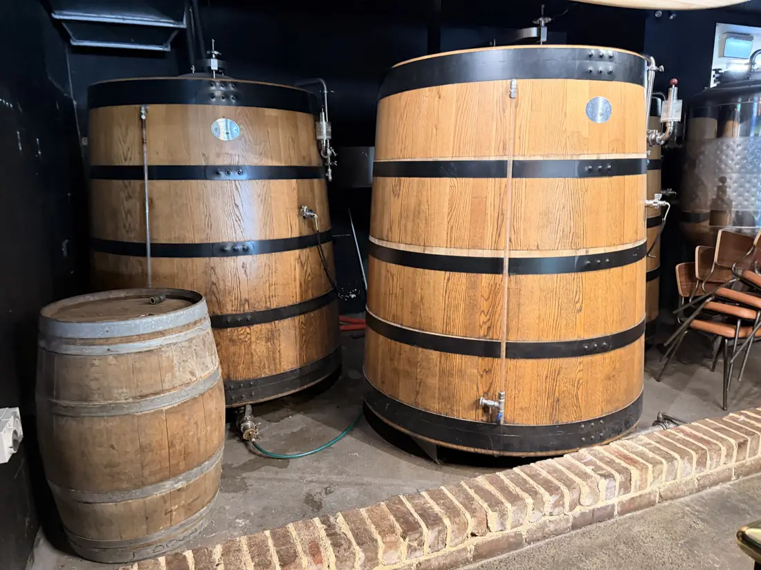 Large brewing vessels beside the raised brick access edge