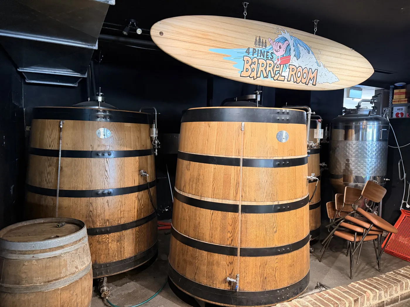 Large timber-clad 4 Pines brewing vessels inside the Mona Vale Barrel Room