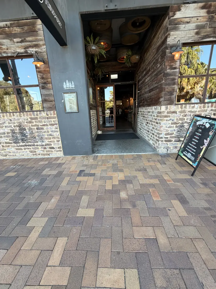 Exterior entrance and uneven paved approach at the Mona Vale venue