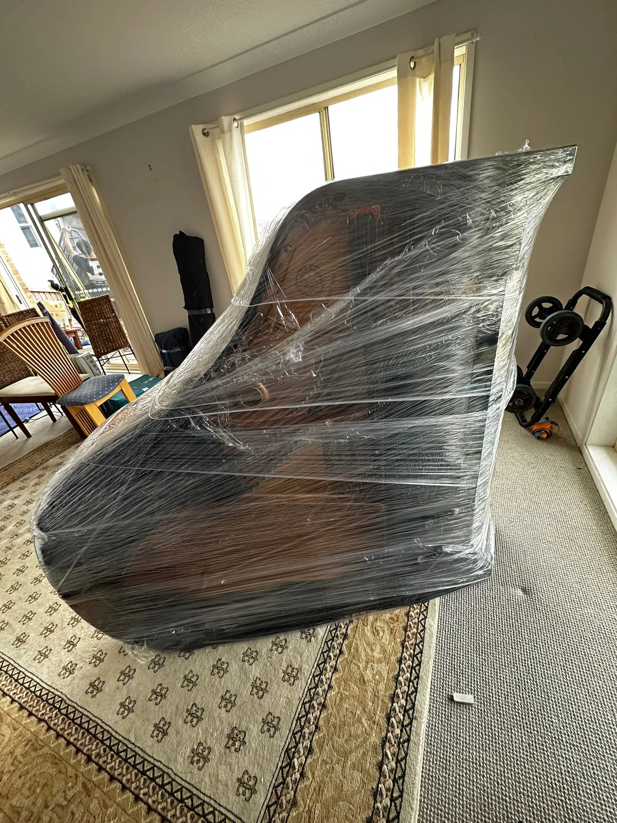 Grand piano wrapped and protected inside a Sydney home