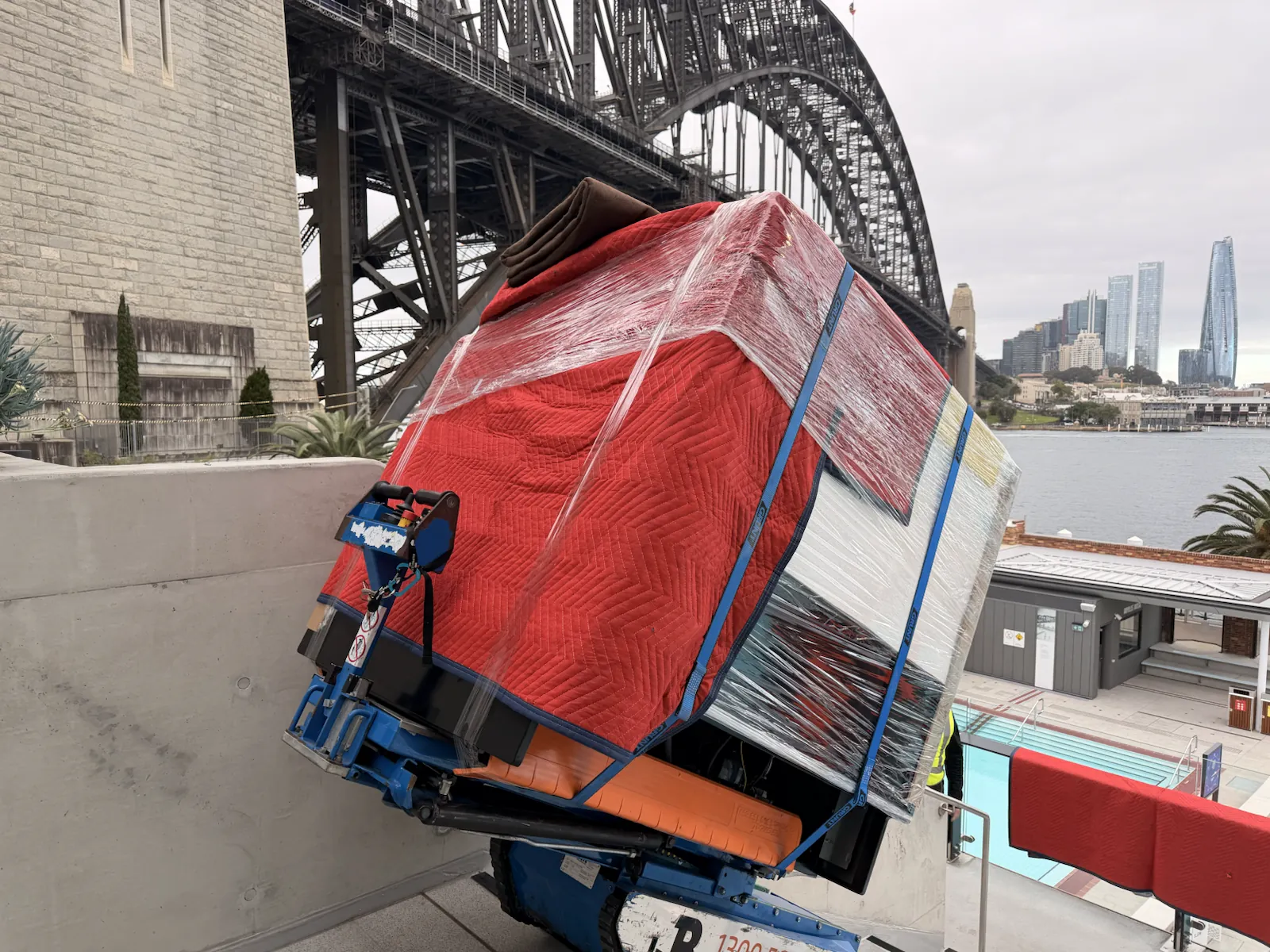 Wrapped 400kg gelato display fridge angled on the Hercules machine at a stair landing