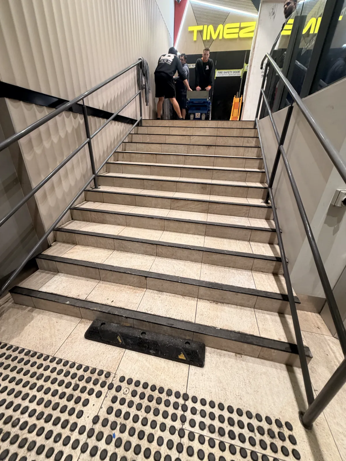 Commercial shopping-centre staircase assessed for the heavy arcade-machine relocation