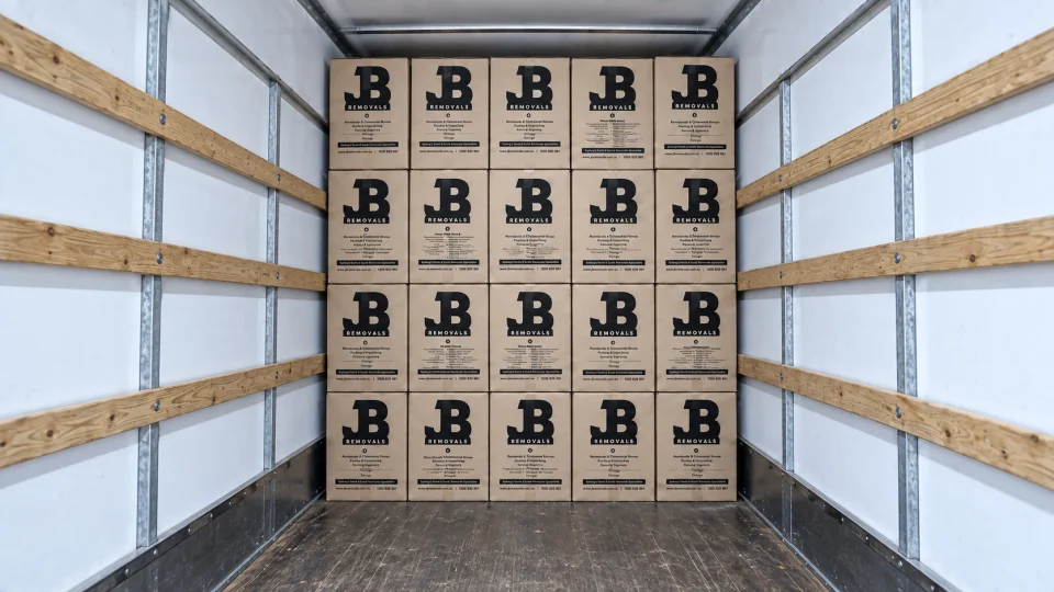 Moving boxes organised inside a JB Removals truck