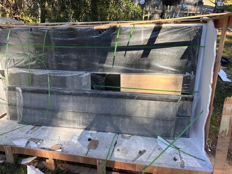 Opened timber shipping crate with industrial equipment inside protective packaging