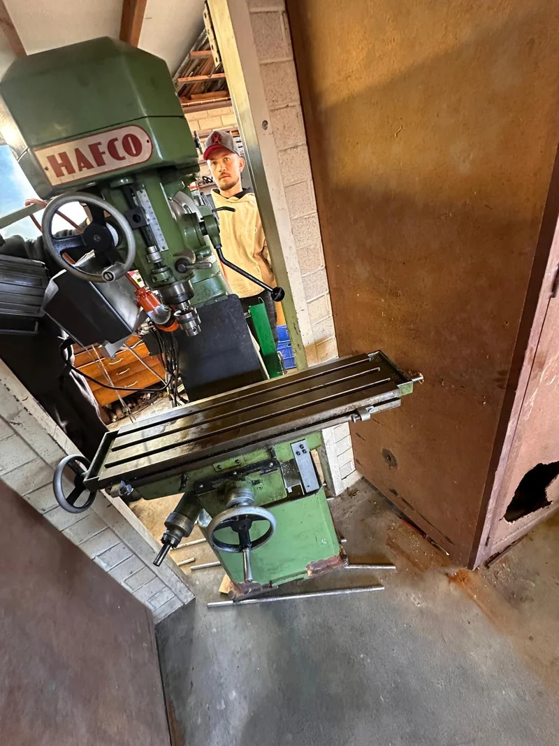 One-tonne milling machine positioned at a narrow workshop doorway