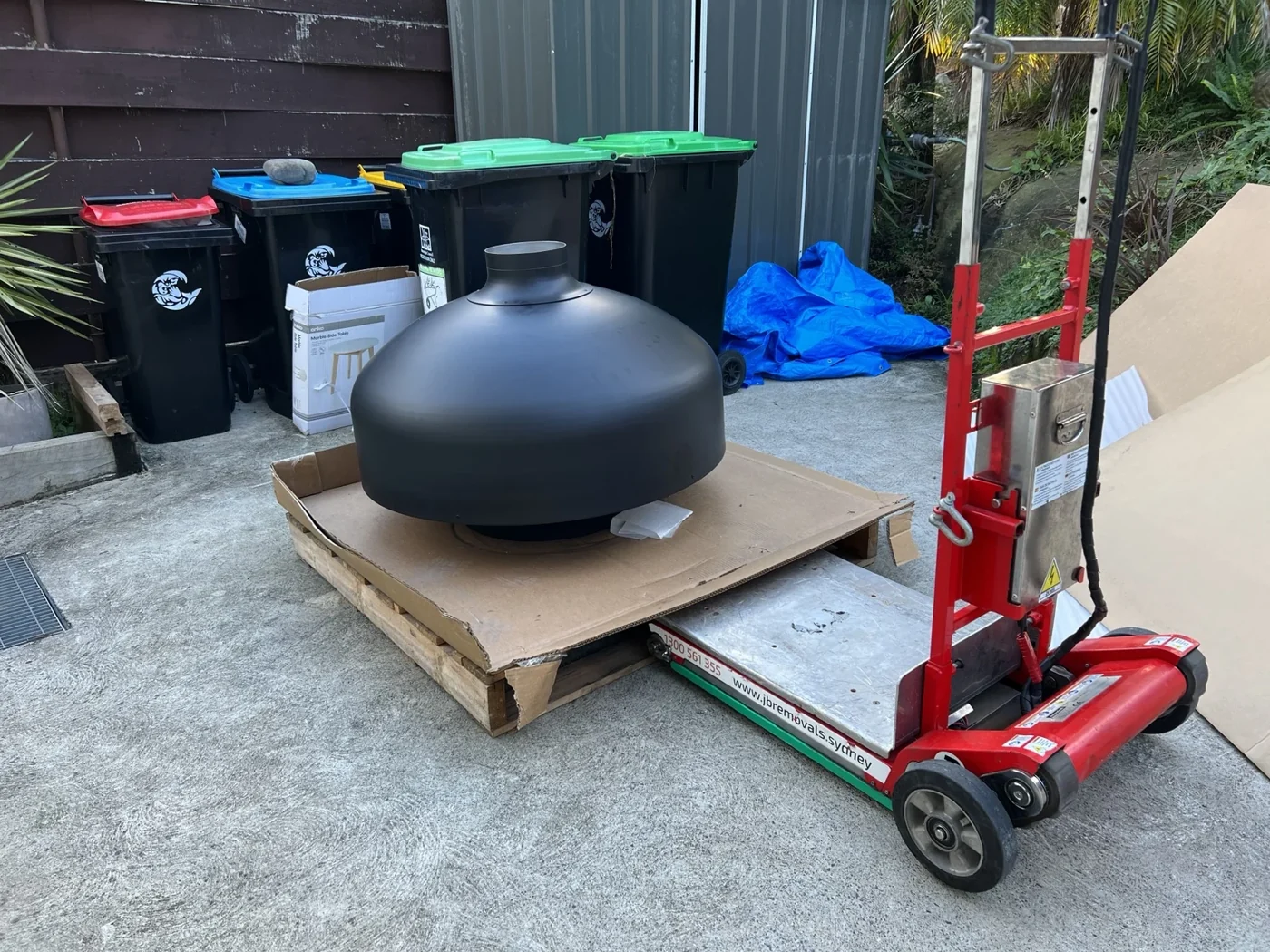 Pizza oven beside JB’s stair climber before handling