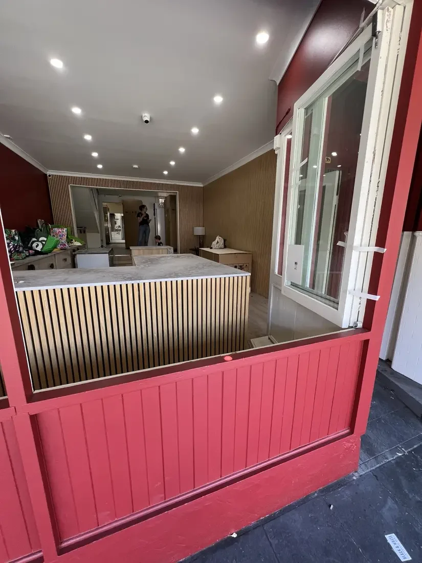 The window opening and marble counter inside the Glebe shop.