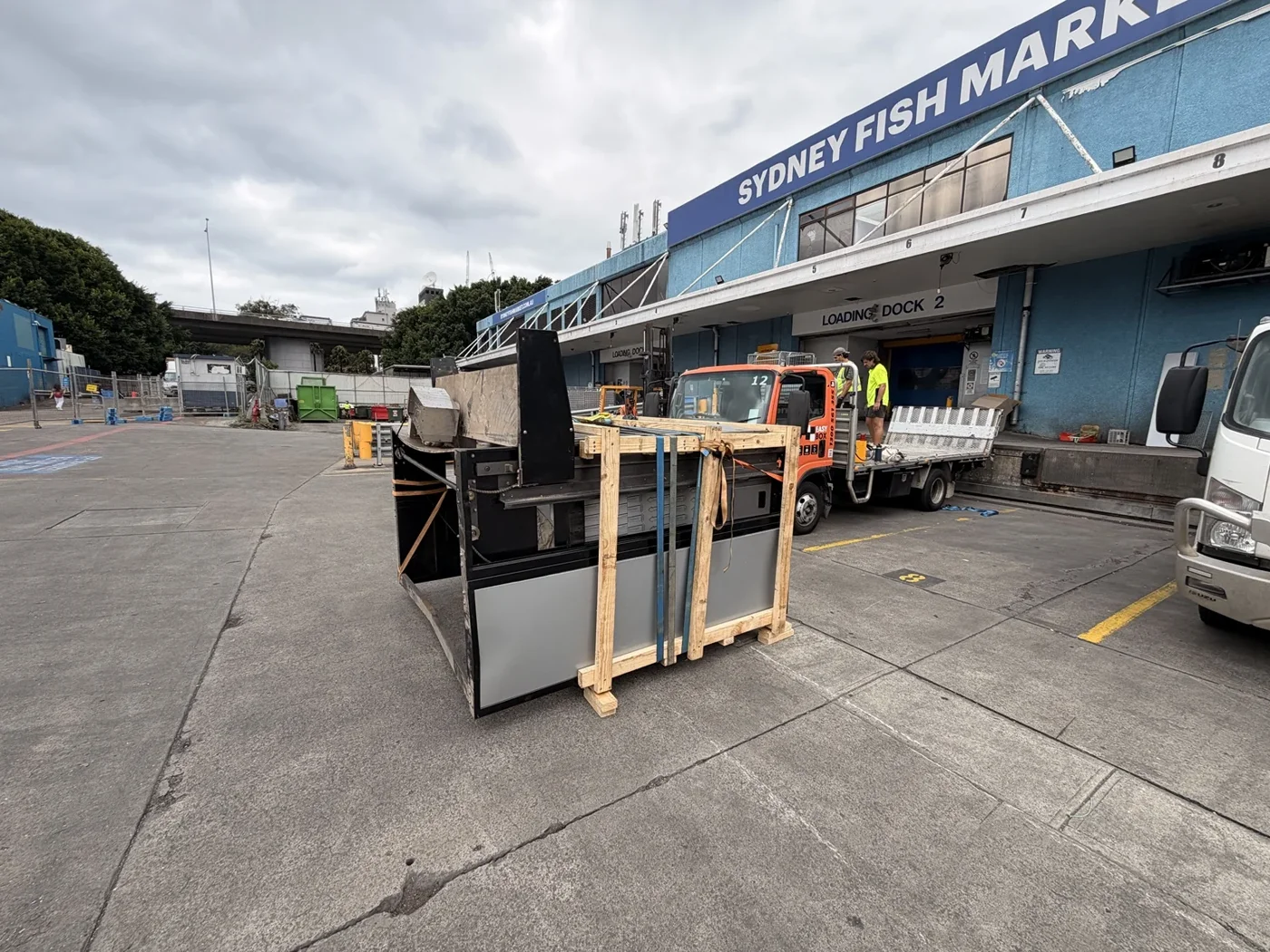Framed commercial oven outside the old Sydney Fish Market beside relocation vehicles