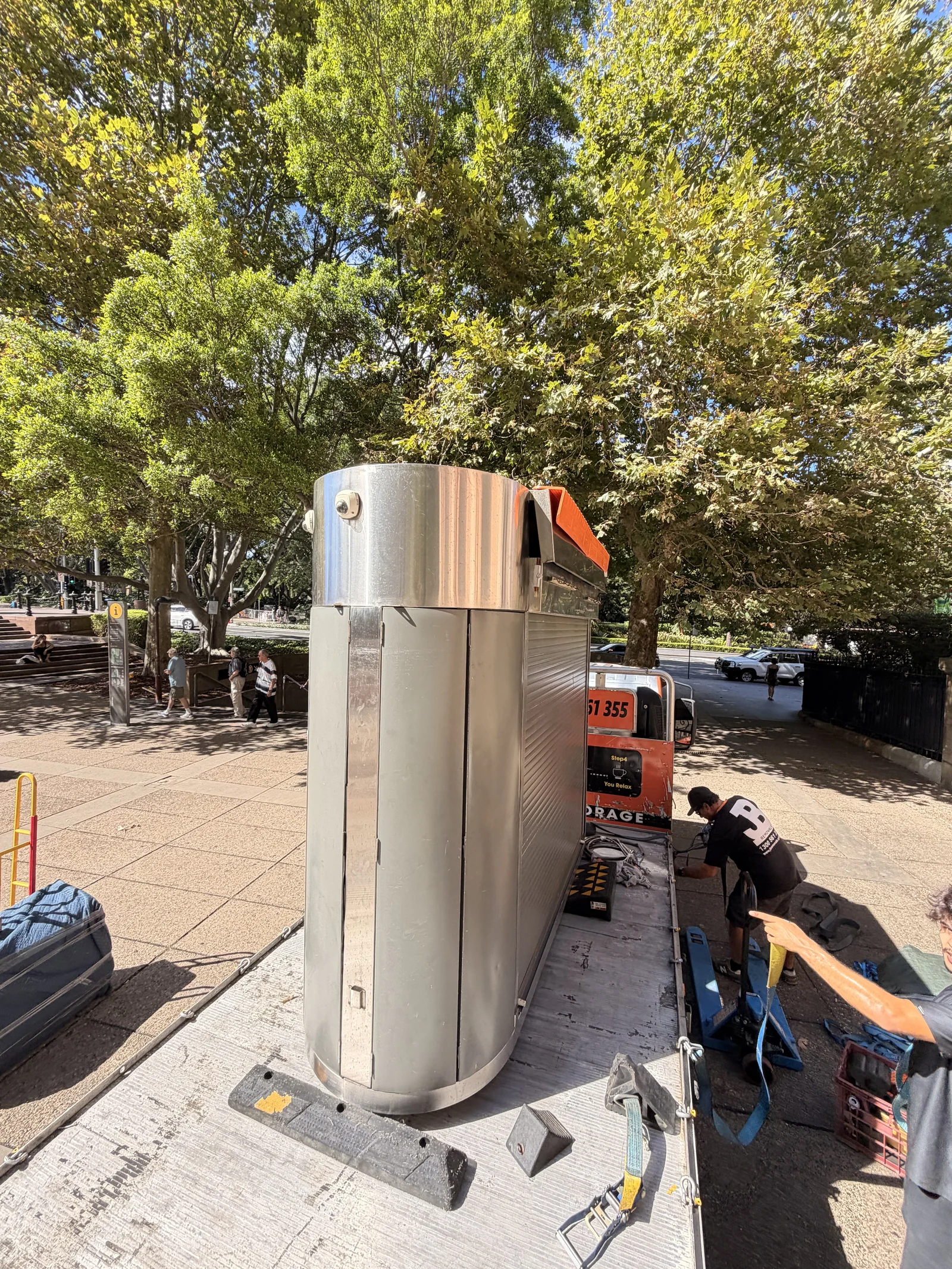 The coffee kiosk upright on the loading platform during the move.