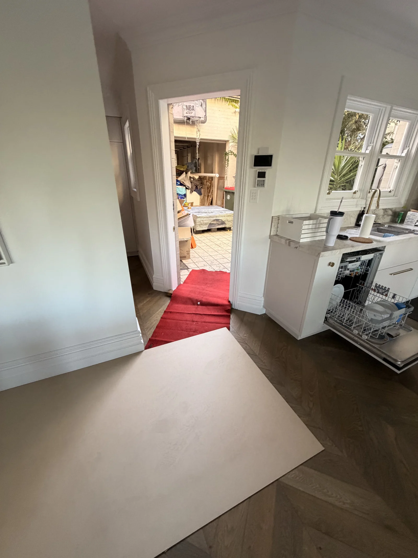 Protective boards and coverings along the table delivery route inside the home.