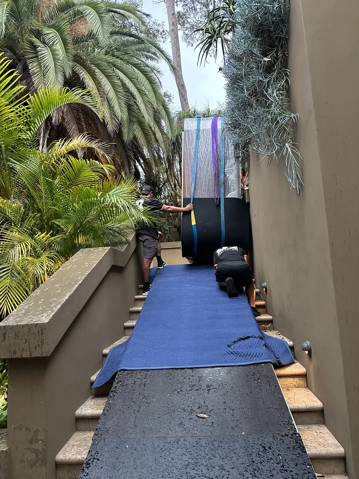 Large wrapped spa beside a garden wall above the protected stair ramp