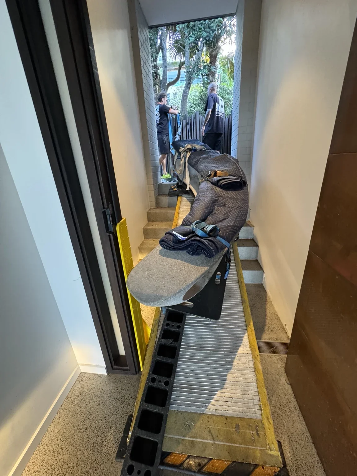 Protected marble bench on the ramp inside a restricted passage