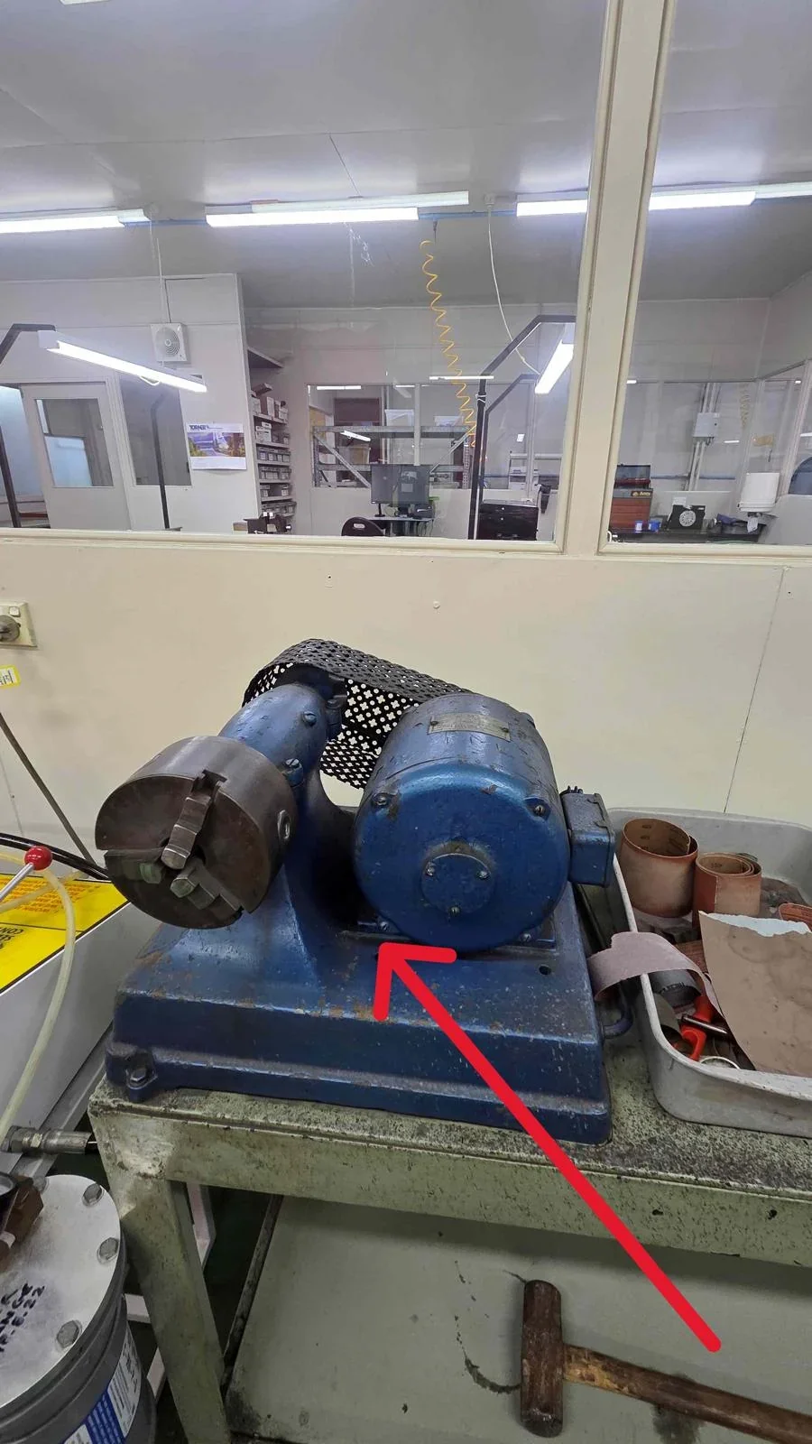 Blue bench-mounted rotary chuck unit identified in the equipment scope
