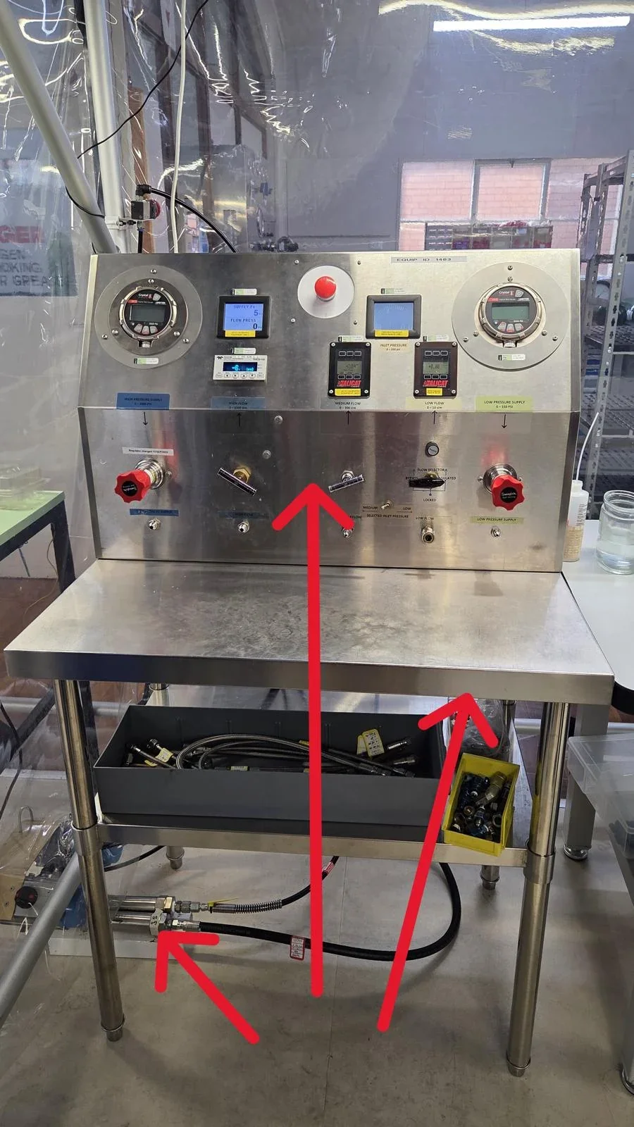 Stainless-steel pressure and flow-control bench marked for relocation