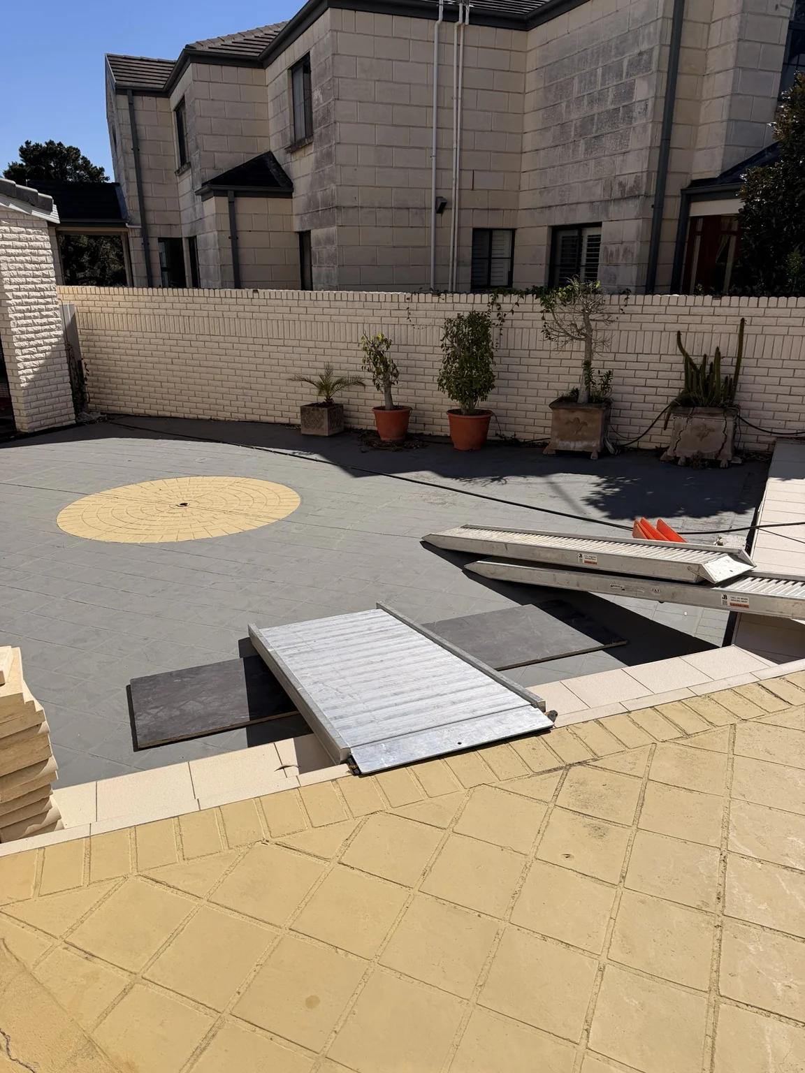 Ramps and boards across an exterior level change at a Sydney property