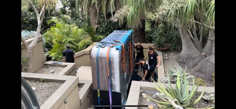 JB Removals: JB crew beside the wrapped spa on the landscaped stair route